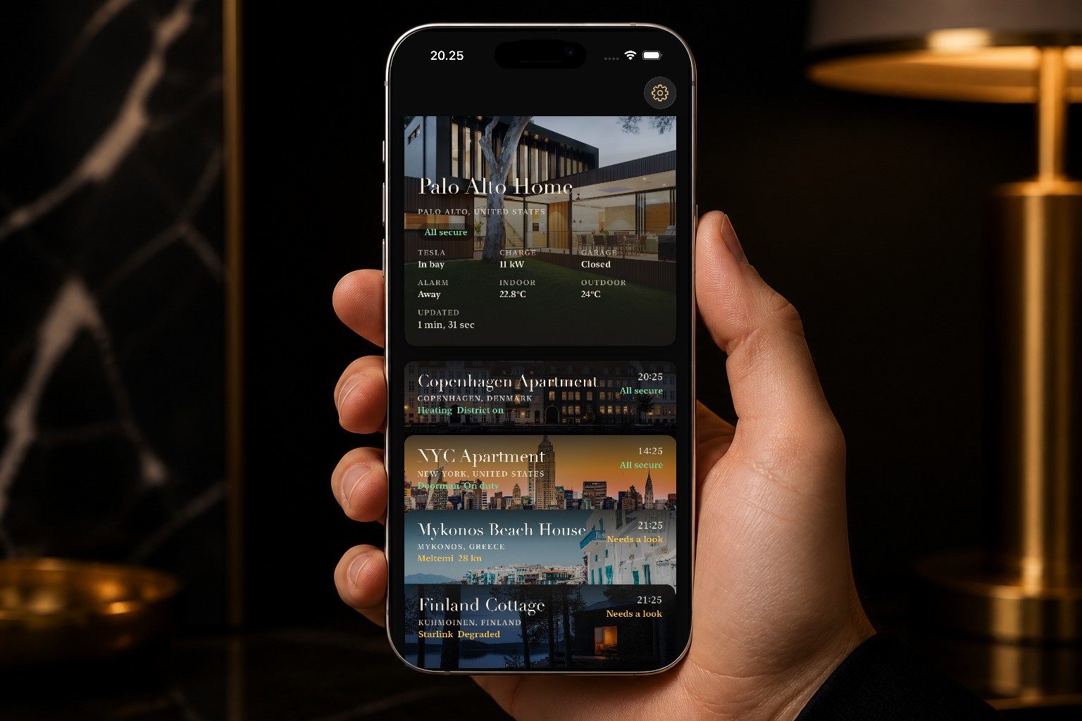 A hand holding a phone. Palo Alto Home is open: Tesla in the bay, alarm away.